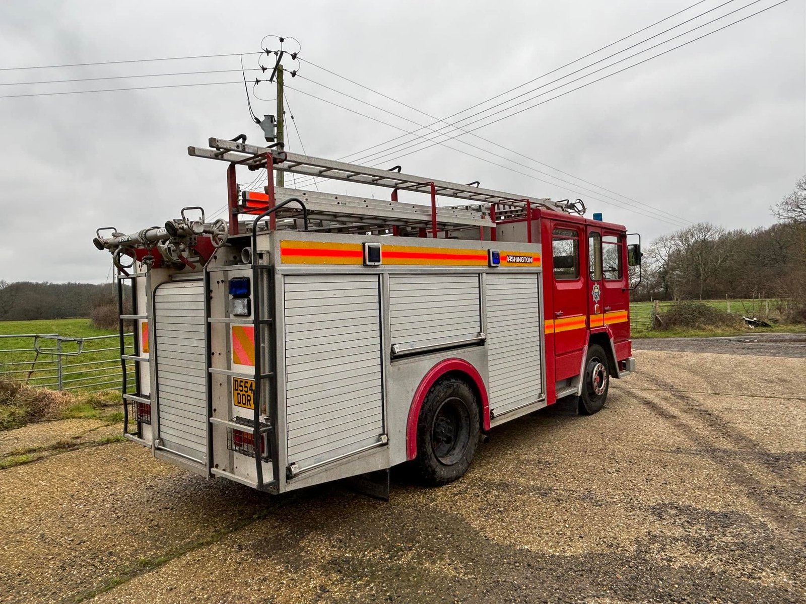 Rear three-quarter of the Dennis fire engine showing the pump, monitor and rear lockers