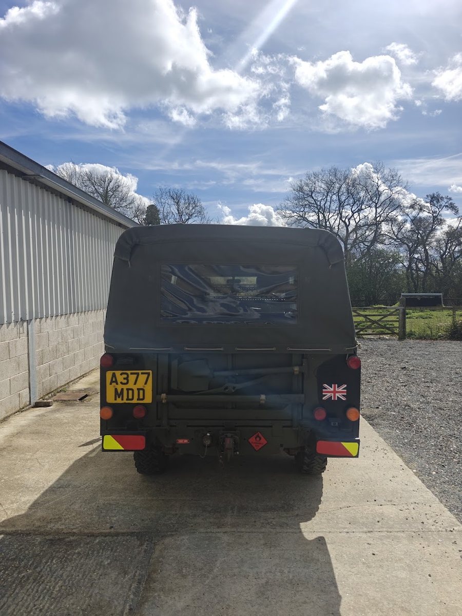 Rear of the Land Rover FFR showing military lighting, tow hitch and Union flag