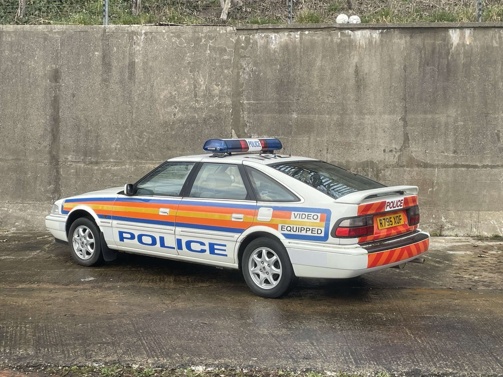 Rear of the classic Rover 800 police car showing POLICE and VIDEO EQUIPPED markings and rear chevrons