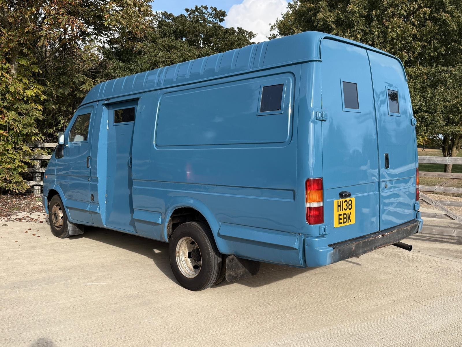 Rear three-quarter of the armoured cash-in-transit van, reg H138 EBK