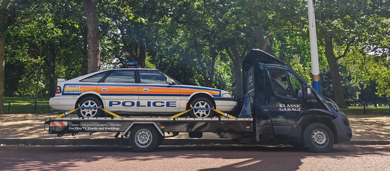 Klassic Garage transporter delivering a period police car