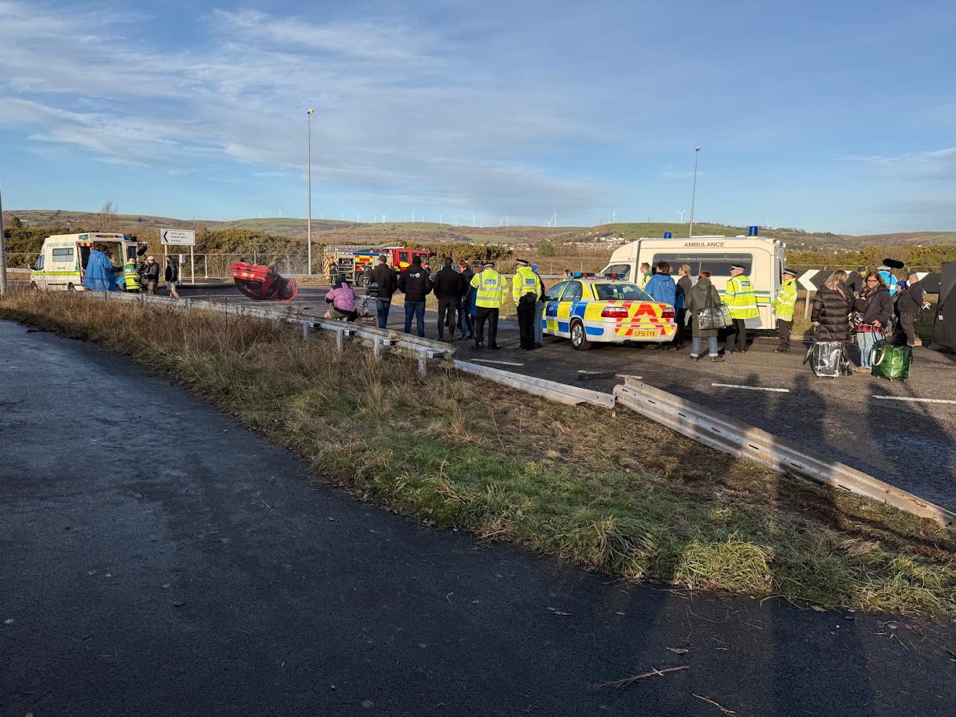 Classic emergency vehicles and crew on location at a staged incident scene