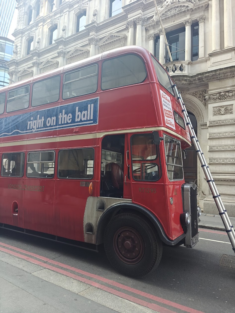 Classic Routemaster bus with advertising livery in London