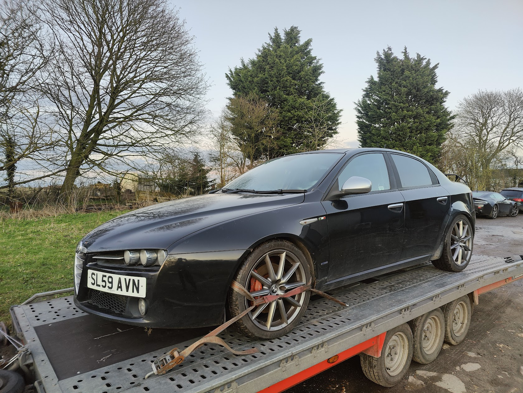 Rally-liveried Mitsubishi Evo secured on the Klassic Garage recovery truck for film vehicle transport